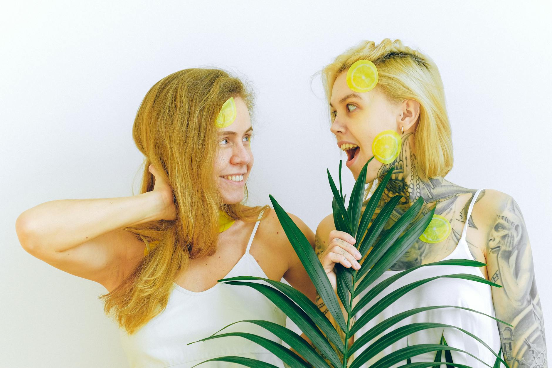 Two fresh lemons in cupped hands, symbolizing gentle recovery and self-care.