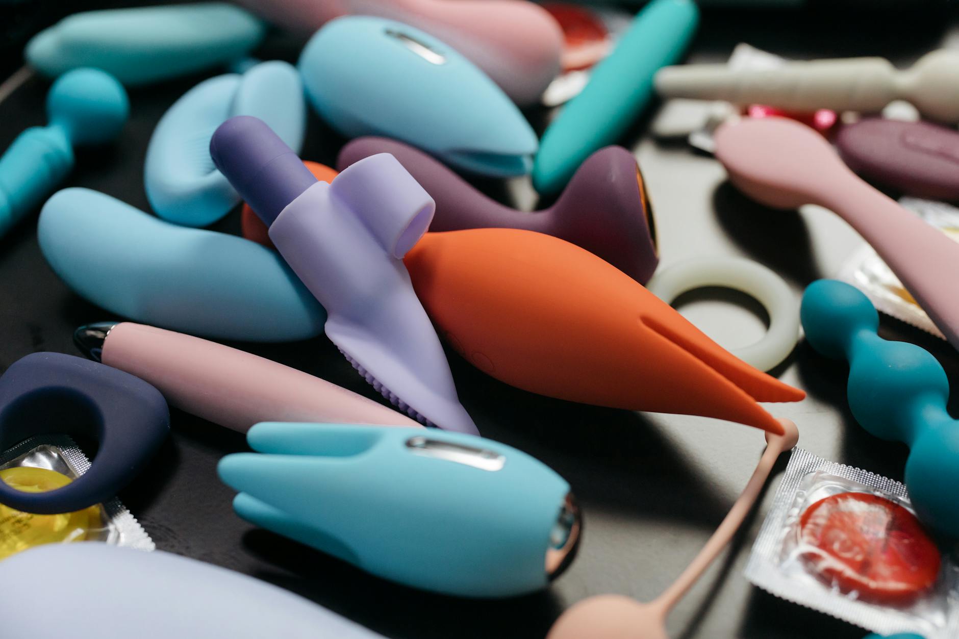 Array of colorful vibrators and intimate wellness tools displayed together